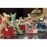 Six Royal Doulton figures to include Christmas Morn,Janine,Autumn Breezes,Ascot and Bedtime Story.