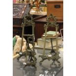 Three ornate brass table top easels