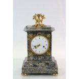 A nineteenth century French grey marble mantle clock by le Paute, a Paris white enamel dial with