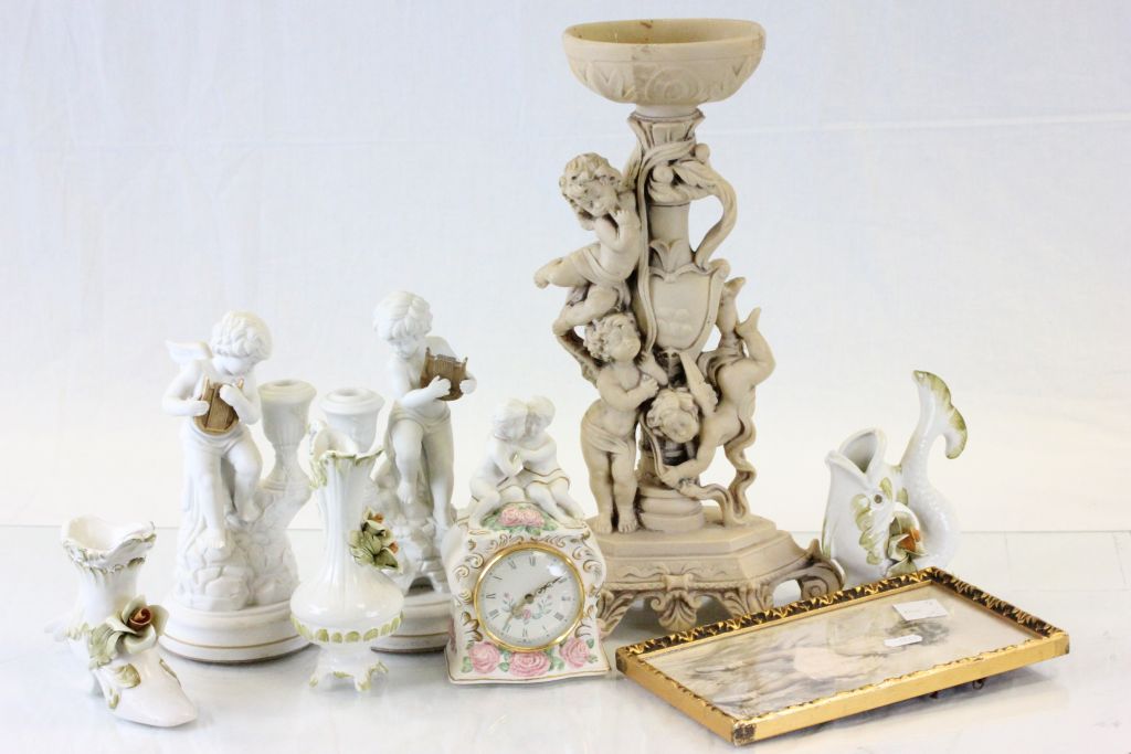 Collection of figures to include a pair of Cherub candlesticks