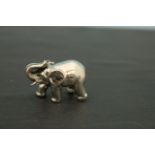 A heavy cast silver figure of an elephant