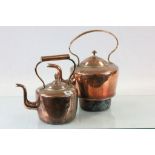 Two large vintage copper kettles