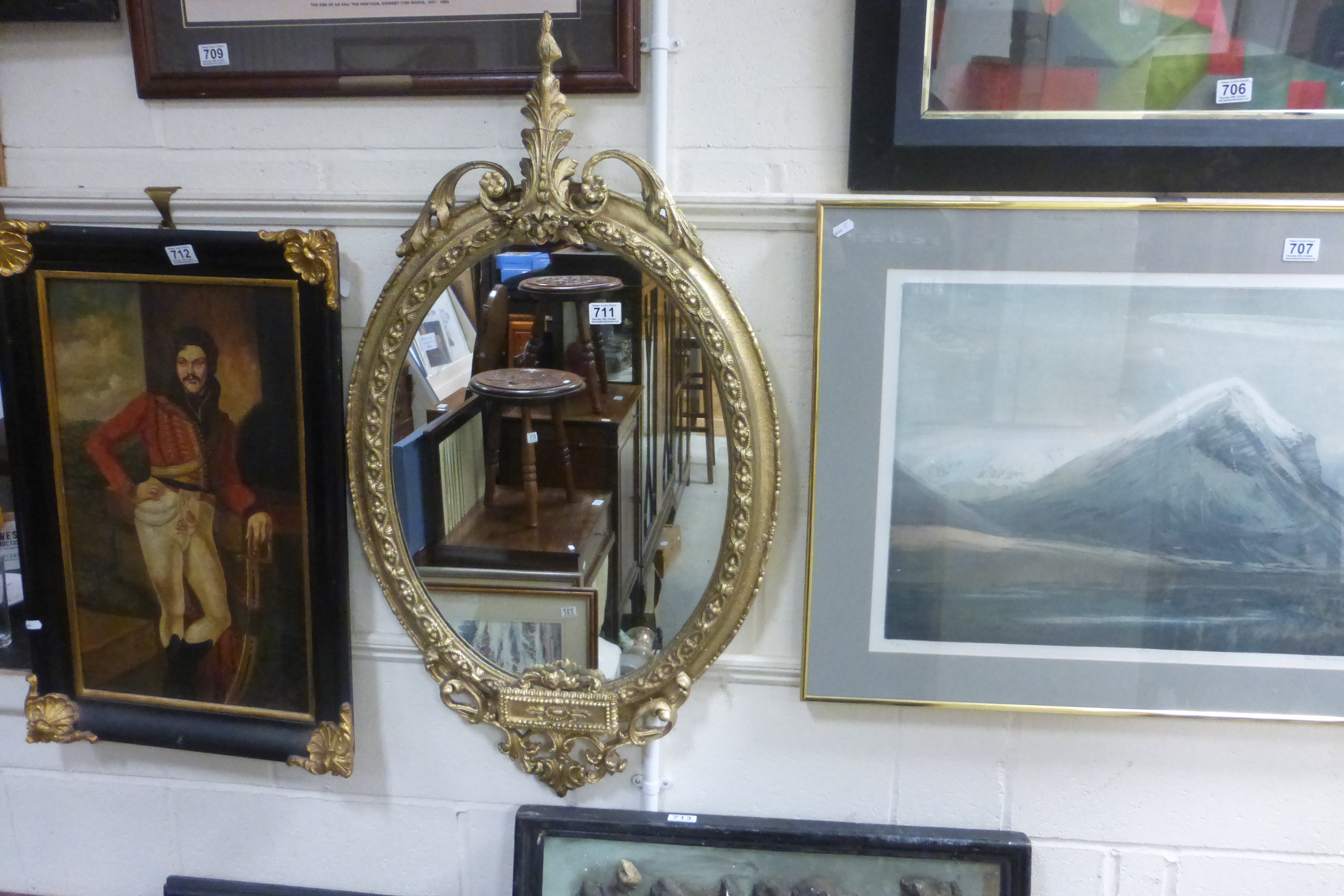 A nineteenth century oval gilt framed mirror