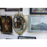 A nineteenth century oval gilt framed mirror