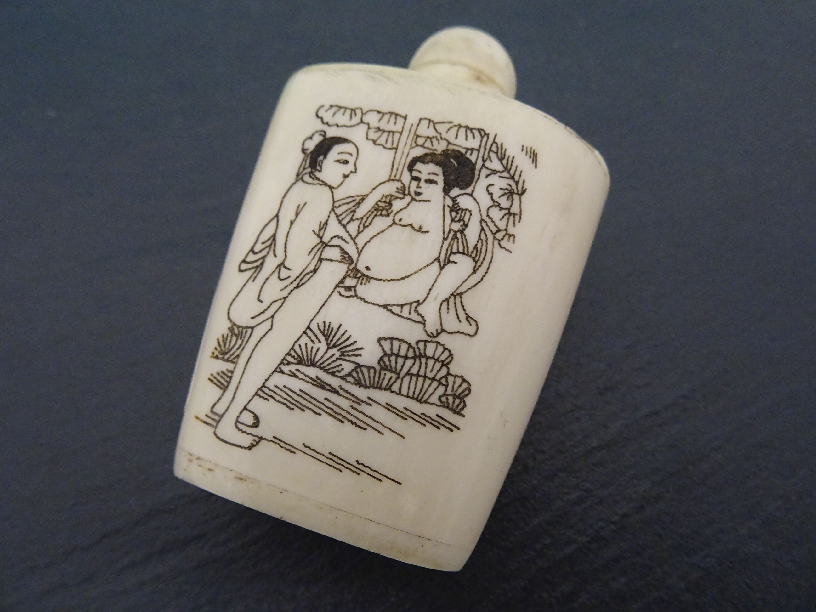 Bone snuff bottle decorated with erotic scenes