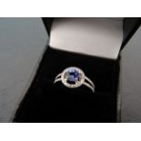 A fine 18ct W/G tanzanite and diamond cluster ring of 1.25cts