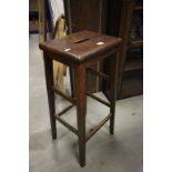 An early vintage elm high stool