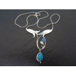 A silver art nouveau style opal set pendant necklace