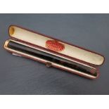 Cased Loewe and co tortoise shell cheroot holder with gold end cap
