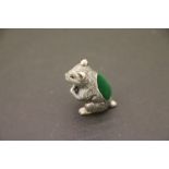 A silver squirrel pin cushion