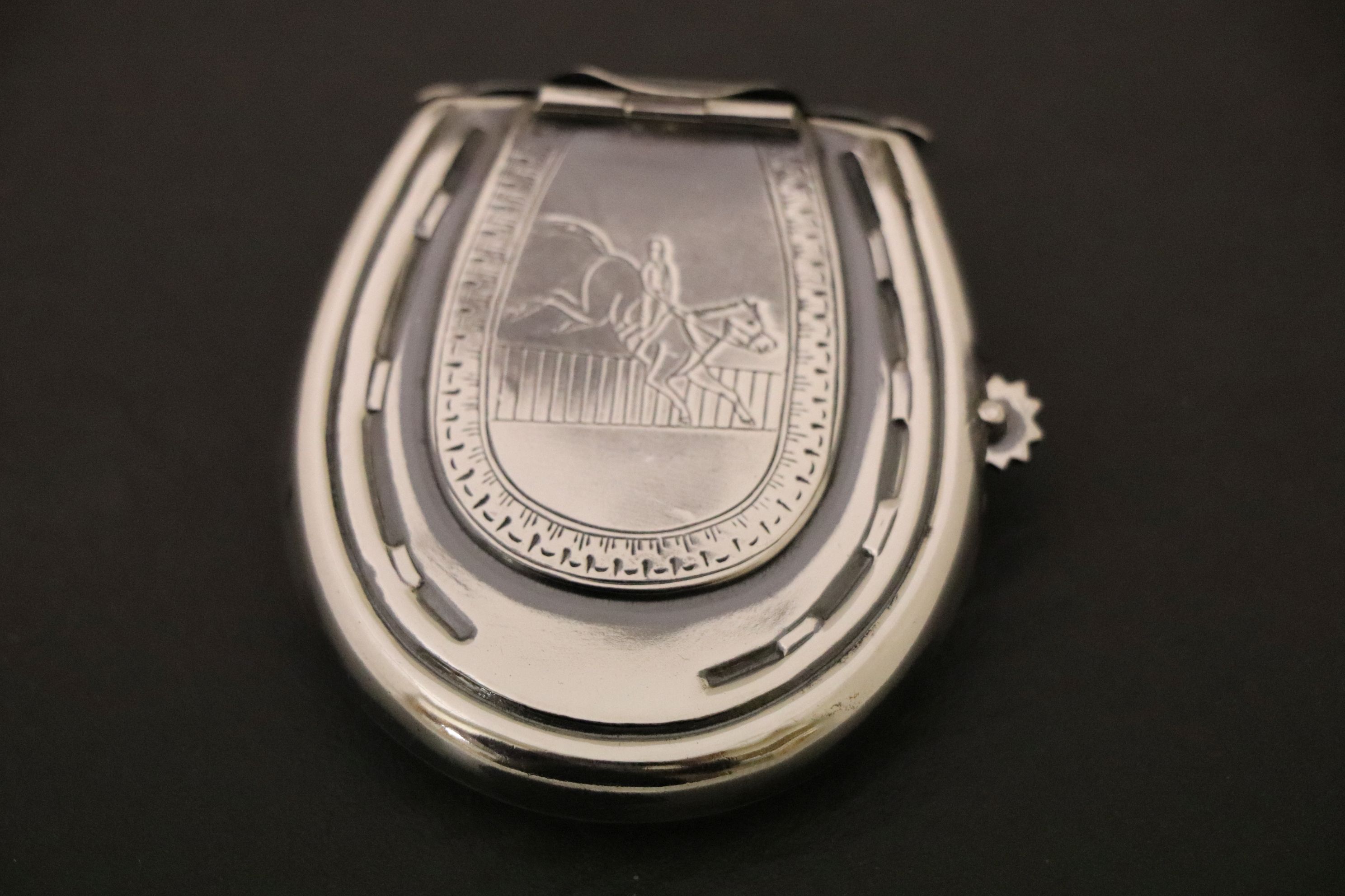 A silver plated vesta case in the form of a horseshoe