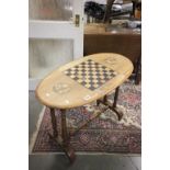 Late 19th / Early 20th century Mahogany Oval Centre Table, the top inlaid with a games board and