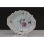 A meissen dish with wavy rim edge and floral pattern
