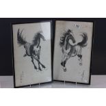 A pair of framed oriental horse prints.