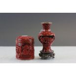 Chinese Cinnabar vase with wooden stand and a similar lidded jar