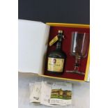 A boxed Chateau de Cognac Baron Otard bottle of brandy with glass together with original paper