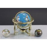 Two small gemstone style globes and one other on stand.
