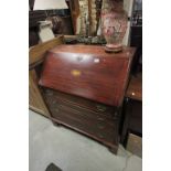 19th century Mahogany Bureau, the hinged drop front revealing a fitted bank of Fourteen Drawers over