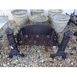 Pair of 19th century Iron Fire Dogs with Floral Motifs together with a Fire Grate