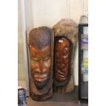 Two large carved wooden African Heads