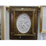 Framed relief picture of a classical scene