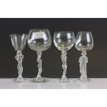 Four French opalescent stemmed wine glasses, three with naked lady stems (1 a/f) and one with
