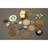 A selection of mixed collectables to include badges, coins etc