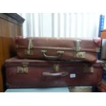 Two vintage suitcases.