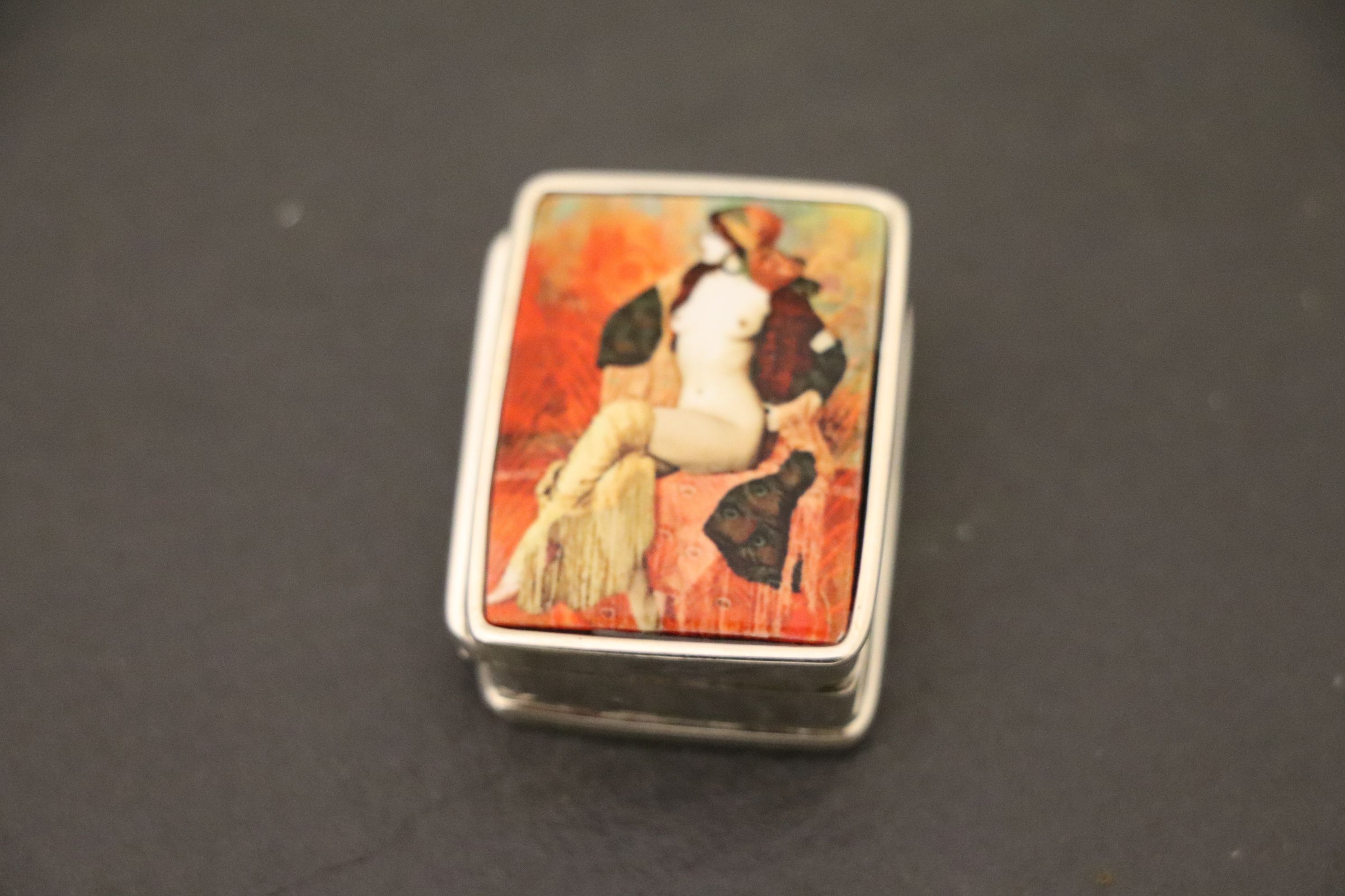 Silver pill box with nude enamel pictorial to lid