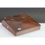 A mahogany lidded writing slope with two drawer fitted interior.