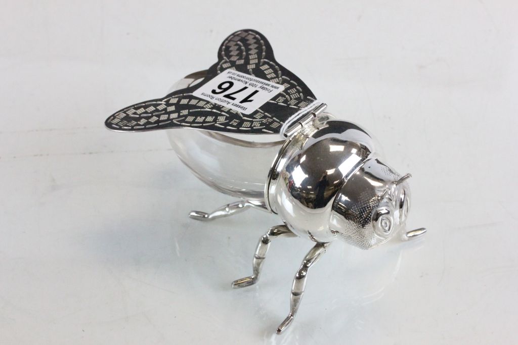 A silver plated honey pot in the form of a bee