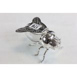 A silver plated honey pot in the form of a bee