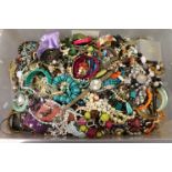 Large plastic tub of mixed costume jewellery