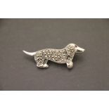 A silver and marcasite sausage dog brooch