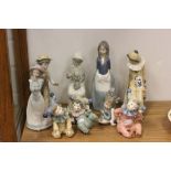 Collection of nine Nao ceramic figures to include child Clowns