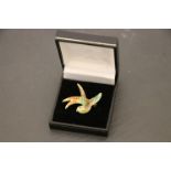 A vintage enamel bird brooch