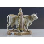 Royal Dux figurine of Milkmaid with Cow, numbered 988 with pink triangle mark to base