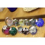 Collection of eleven mainly Caithness glass paperweights