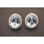 Pair of impressive silver cz and aquamarine earrings