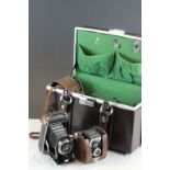 A leather fitted case containg a vintage Ross Ensign camera together with a Voighonger Bessa