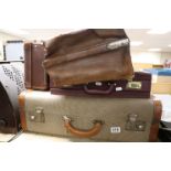 A vintage leather gladstone style briefcase,an attache case and two others.