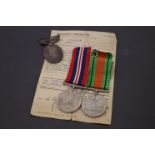 Boxed set of three WW2 Medals with Discharge papers