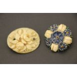 An ivory carved floral decorated brooch and one other similar in bone.