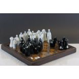 Vintage chess board with ceramic chess pieces