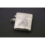 A silver vesta case with embossed golf figure