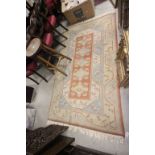 Pale Orange, Blue, Green and Cream Ground Rug