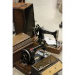 Two cased vintage Singer sewing machines one dated 1913 with manual together with a boxed vintage