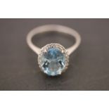 A substantial silver cz and aquamarine ring