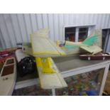 Collection of radio controlled airplanes and accessories including box Plane Nutz airplane and three