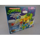 Original boxed Playmates Bandia Teenage Mutant Ninja Turtles Double Barrelled Plunger Gun, opened